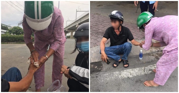 Hình ảnh người phụ nữ tất bật chăm sóc cho người đàn ông bị tai nạn giao thông.