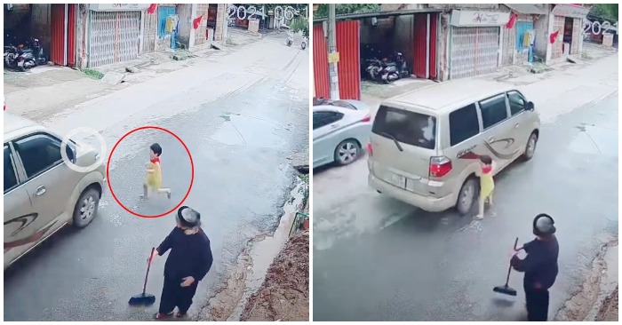 Em bé lao sang đường suýt bị ô tô tông trúng (ảnh cắt từ clip).