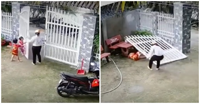 2 cháu nhỏ suýt bị cánh cổng sắt đổ ập vào người (ảnh cắt từ clip).