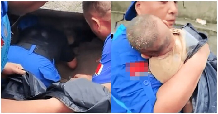 Em bé khoảng 3-4 tháng được đội cứu hộ giải cứu từ đống đổ nát (ảnh cắt từ clip).