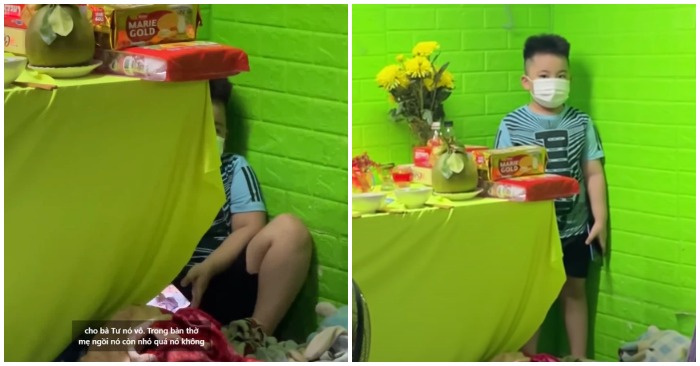 Em nhỏ hàng ngày nép vào một góc trong bàn thờ mẹ (ảnh cắt từ clip).