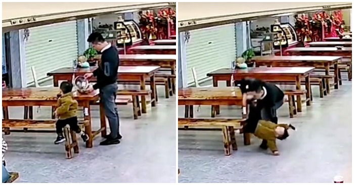 Ông bố phản ứng cực nhanh giúp cậu con trai tránh đập đầu xuống đất khi ngã (ảnh cắt từ video).