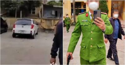 Đang xác minh video công an một tay cầm điện thoại quay, một tay cầm vật giống súng nói chuyện với dân